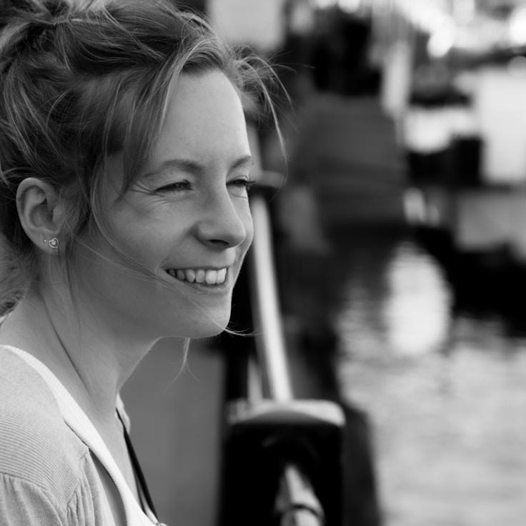 Kaveri Mehta, Lead Design Curator at Silent Paper Guide, reviewing corporate floral arrangements